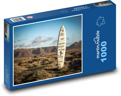 Surfová doska uviaznutá v zemi - Puzzle 1000 dielikov, rozmer 60x46 cm