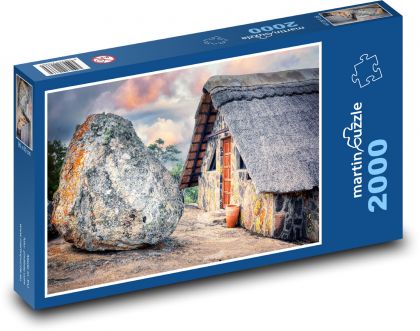Kamenný domek s velkým balvanem - puzzle 2000 dílků