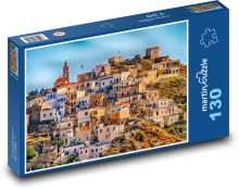 A small town on a hill by the sea Karpathos, Greece Puzzle 130 pieces - 28.7 x 20 cm 