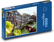 Kanál tekoucí mezi domy Puzzle 1000 dílků - 60 x 46 cm