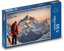 Alpinista w zaśnieżonych górach Puzzle 130 elementów - 28,7x20 cm