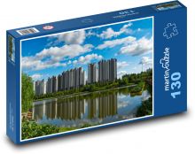 Výškové budovy u řeky Puzzle 130 - 28,7x20 cm