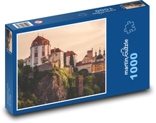 Vranov nad Dyjí Chateau, situated on the southern border of the Czech state about 110 km from Vienna, is one of the most remarkable secular buildings of the Central European Baroque. It emerged from a conversion of a castle of the provincial nobility... Puzzle 1000 pieces - 60 x 46 cm 