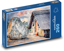 Stone house with a large boulder Puzzle 260 pieces - 41 x 28.7 cm