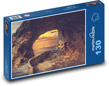 Jaskinia nad morzem - skała, zachód słońca Puzzle 130 elementów - 28,7x20 cm