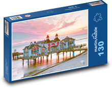 Häuser am Meer - Pier, Sonnenuntergang Puzzle 130 Teile - 28,7x20 cm